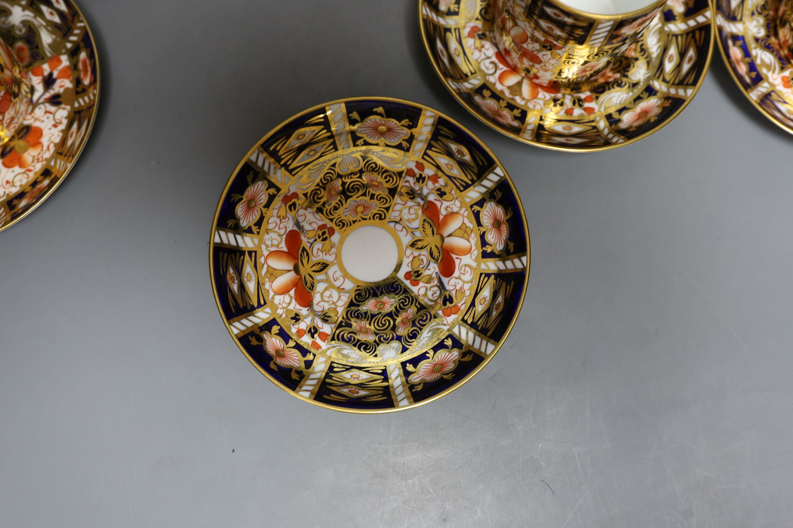 A Royal Crown Derby 6 set of coffee cans, 7 saucers and a similar Davenport cup and saucer (14)